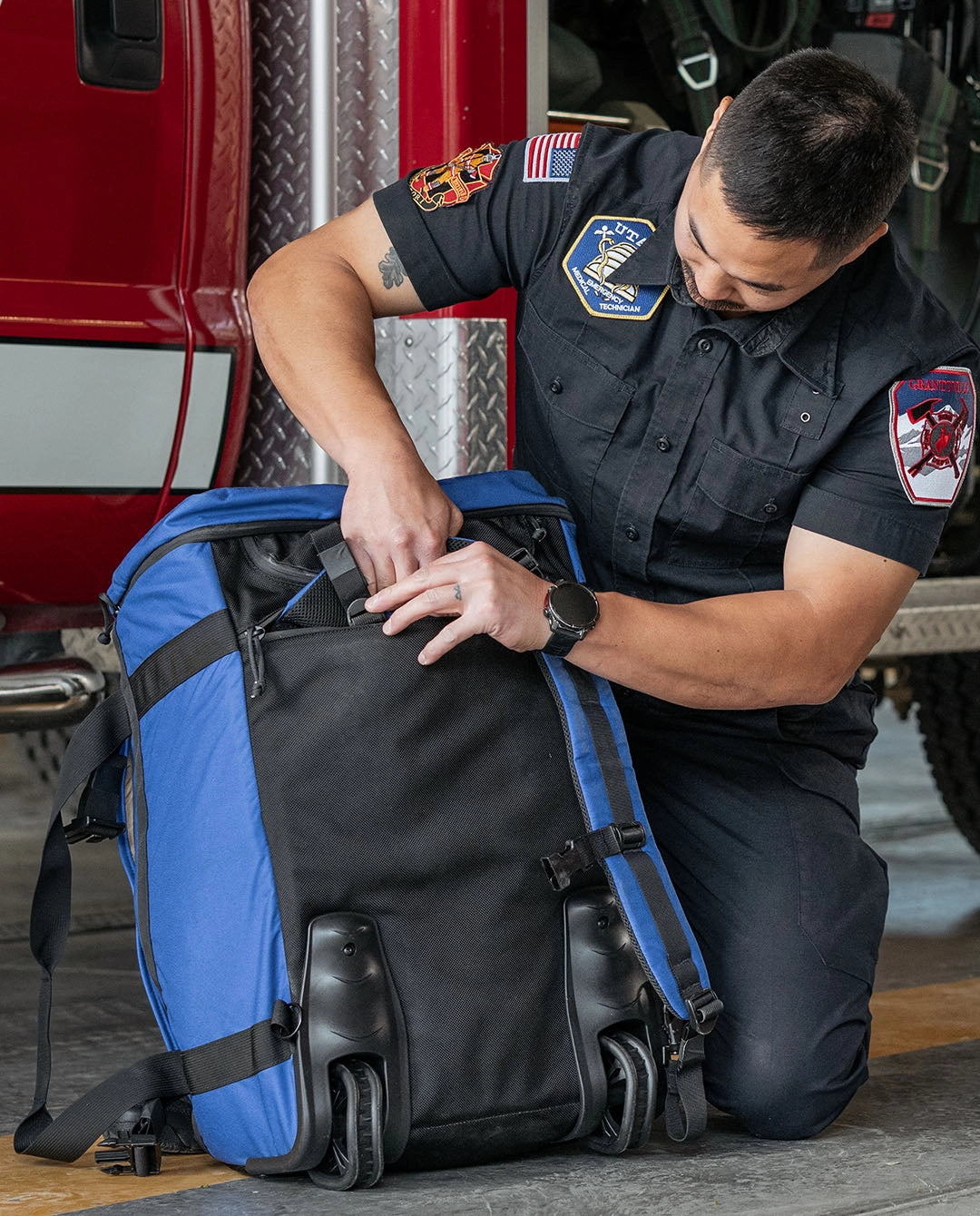 Rear backpack harness on the Thin Air Gear Pike deployment bag with stowable shoulder straps and rolling wheel system