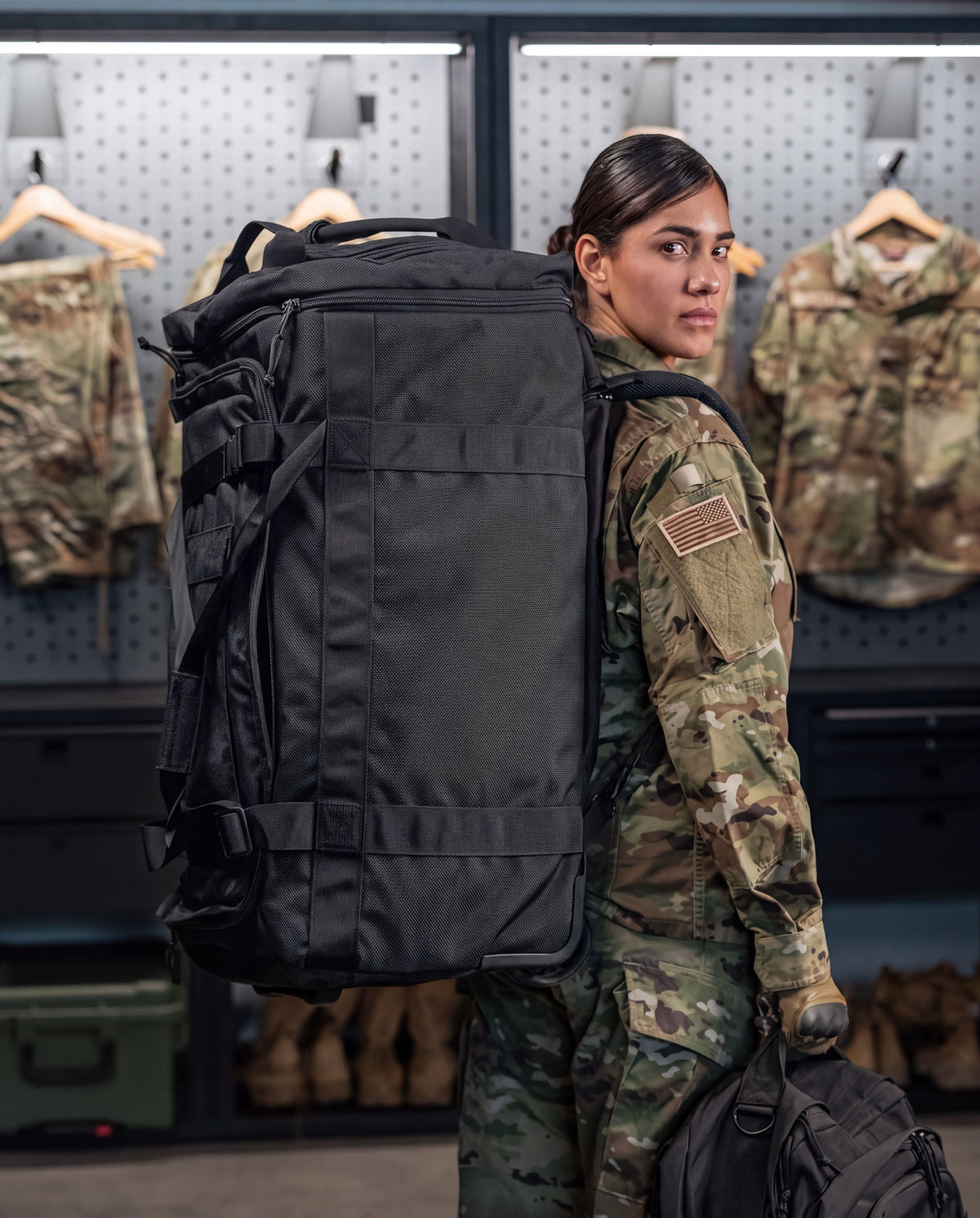 black rolling duffel on female back using backpack straps